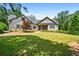 Charming stone and siding home with a well-manicured lawn and inviting front porch at 150 Seals Rd, Dallas, GA 30157