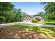 Spacious three-car garage with ample parking on a circular driveway at 150 Seals Rd, Dallas, GA 30157