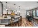 Bright kitchen with white cabinets, granite countertops, a center island, and stainless appliances at 150 Seals Rd, Dallas, GA 30157