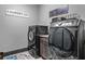 This is a laundry room with modern appliances and decor at 150 Seals Rd, Dallas, GA 30157