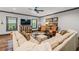 Comfortable living room with ample seating, a ceiling fan and natural light at 150 Seals Rd, Dallas, GA 30157