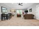 Carpeted living room featuring comfortable seating and a dining table with a door to the side at 150 Seals Rd, Dallas, GA 30157