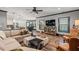 Open-concept living room leading to a kitchen with hardwood floors and a neutral color palette at 150 Seals Rd, Dallas, GA 30157