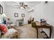 Bright and spacious home office with multiple desks, comfortable seating, and a ceiling fan to promote productivity at 150 Seals Rd, Dallas, GA 30157