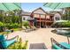 Resort style backyard with outdoor seating, pool, and lush landscaping at 150 Seals Rd, Dallas, GA 30157
