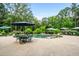 A stunning backyard pool with a lounge area and lush landscaping at 150 Seals Rd, Dallas, GA 30157