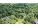 An aerial view of the wooded lot surrounding the home with a private pool at 402 Clyde Ct, Mcdonough, GA 30252