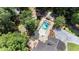 Aerial view of pool with jacuzzi and gazebo surrounded by lush, mature trees at 402 Clyde Ct, Mcdonough, GA 30252