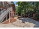Backyard brick patio with outdoor kitchen and grill area at 402 Clyde Ct, Mcdonough, GA 30252