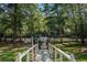 Scenic backyard with bridge leading to a lake gazebo at 402 Clyde Ct, Mcdonough, GA 30252