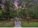 Picturesque backyard with access to the river, a tranquil bridge, and serene surroundings at 402 Clyde Ct, Mcdonough, GA 30252