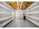 Spacious unfinished basement with sealed floors and ample shelving space at 402 Clyde Ct, Mcdonough, GA 30252