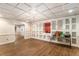 Versatile basement space with built-in cabinets, wood-look flooring, and ample lighting at 402 Clyde Ct, Mcdonough, GA 30252