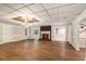 Finished basement featuring a brick fireplace, wood-look floors, and ample space for entertainment and recreation at 402 Clyde Ct, Mcdonough, GA 30252