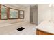 Bathroom featuring a jetted tub, a glass enclosed shower, and a double sink vanity at 402 Clyde Ct, Mcdonough, GA 30252