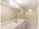 Bright bathroom with a long countertop, ample cabinet space, and a shower-tub combination at 402 Clyde Ct, Mcdonough, GA 30252