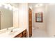 Bright bathroom featuring vanity sink, wood cabinet and tile flooring at 402 Clyde Ct, Mcdonough, GA 30252