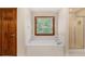 Bright bathroom featuring a tiled soaking tub, and a clear glass shower door at 402 Clyde Ct, Mcdonough, GA 30252