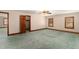 Spacious bedroom with multiple windows, ceiling fan, and neutral carpet flooring offers comfort at 402 Clyde Ct, Mcdonough, GA 30252