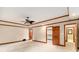 Large bedroom with neutral walls, white carpet, and multiple closets at 402 Clyde Ct, Mcdonough, GA 30252