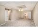 Spacious bedroom featuring neutral-toned walls, soft carpeting, and a ceiling fan, creating a welcoming and comfortable atmosphere at 402 Clyde Ct, Mcdonough, GA 30252