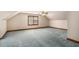 Large bedroom with carpet, baseboard trim, and a window for natural light at 402 Clyde Ct, Mcdonough, GA 30252