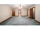 Neutral bedroom with carpet, trim, and two open doors offering space to walk through at 402 Clyde Ct, Mcdonough, GA 30252