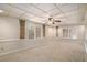 Serene bedroom with soft carpeting, bright windows with blinds, and decorative pillars offering a peaceful retreat at 402 Clyde Ct, Mcdonough, GA 30252