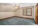 Bedroom featuring blue carpet, wooden trim, ceiling fan and a sunlit window at 402 Clyde Ct, Mcdonough, GA 30252