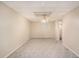 Bedroom featuring carpet flooring, ceiling fan and neutral walls with a window at 402 Clyde Ct, Mcdonough, GA 30252