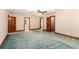 Expansive bedroom featuring three doorways, a ceiling fan, and neutral carpet flooring offers space at 402 Clyde Ct, Mcdonough, GA 30252