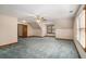 Spacious carpeted bedroom with a trim and a window for natural light at 402 Clyde Ct, Mcdonough, GA 30252
