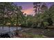 Spacious deck overlooking a flowing river with decorative lighting at 402 Clyde Ct, Mcdonough, GA 30252
