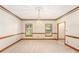 Dining room featuring wood trim, carpet flooring, and chandelier lighting at 402 Clyde Ct, Mcdonough, GA 30252