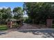 Brick entrance to the property with a gated driveway at 402 Clyde Ct, Mcdonough, GA 30252