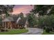 Beautiful brick home with an attached garage, mature trees, and lush landscaping at 402 Clyde Ct, Mcdonough, GA 30252