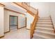 Bright foyer with tiled floor, staircase, and wood trim at 402 Clyde Ct, Mcdonough, GA 30252