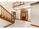 Welcoming foyer with wood trim, staircase, and decorative glass front door at 402 Clyde Ct, Mcdonough, GA 30252