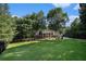 Expansive front lawn leading to a grand two-story brick home at 402 Clyde Ct, Mcdonough, GA 30252