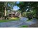 Stately brick home with a manicured lawn and a circular driveway at 402 Clyde Ct, Mcdonough, GA 30252