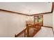 Elegant hallway featuring a decorative chandelier, wood trim, and double doors leading to the outdoors at 402 Clyde Ct, Mcdonough, GA 30252