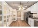 Kitchen showcases updated appliances, ample cabinet space and luxury vinyl flooring at 402 Clyde Ct, Mcdonough, GA 30252