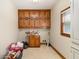 Laundry room featuring wood cabinets and vinyl flooring at 402 Clyde Ct, Mcdonough, GA 30252
