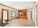 Living space with wood floors, built-in wood cabinetry, bay windows, and a cozy seating area at 402 Clyde Ct, Mcdonough, GA 30252
