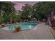 Swimming pool and landscaped backyard with outdoor features at 402 Clyde Ct, Mcdonough, GA 30252