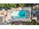 Aerial view of a large in-ground pool with a diving board, and a large patio area at 402 Clyde Ct, Mcdonough, GA 30252