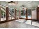 Bright sunroom with brick columns and tile flooring leading to the pool at 402 Clyde Ct, Mcdonough, GA 30252