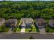 Aerial view showcasing the home's location with well-manicured lawns and mature trees, perfect for a Gathering at 5240 Bristlecone Pine Way, Cumming, GA 30040