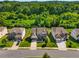 Aerial shot of a well-maintained home in a suburban neighborhood, showcasing its manicured lawn and mature trees at 5240 Bristlecone Pine Way, Cumming, GA 30040