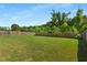 A large, well-maintained backyard with a full lawn and wooden fence at 5240 Bristlecone Pine Way, Cumming, GA 30040